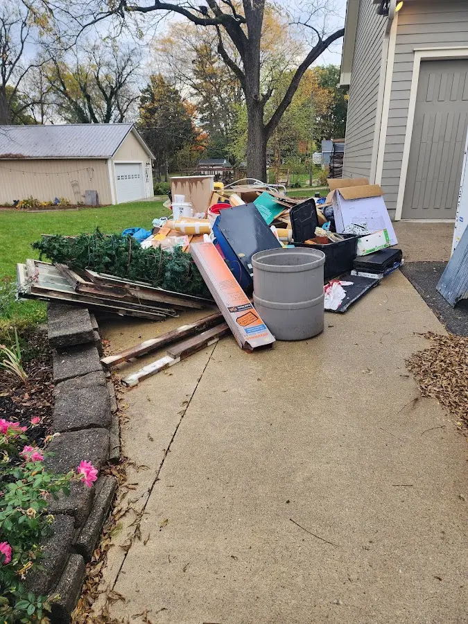 Dumpster being loaded with debris for 10 Yard Dumpster Rental in Marlborough